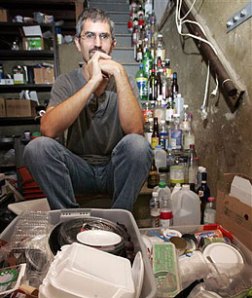 Dave Chameides with six months of trash in his basement in LA. 