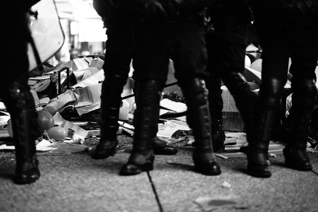 In Paris, police in riot gear attacked tents and then rigorously guarded the piles of trash they made. November 15, 2011. Photo by Sebastien Gabriel Meriadeck. 