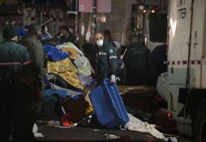 Original photo and caption from the LA Times coverage of the settlement: "New York sanitation workers remove debris and belongings left by protesters of Occupy Wall Street from Zuccotti Park during a nighttime raid on Nov. 15, 2011. (Carolyn Cole / Los Angeles Times / November 15, 2011)"