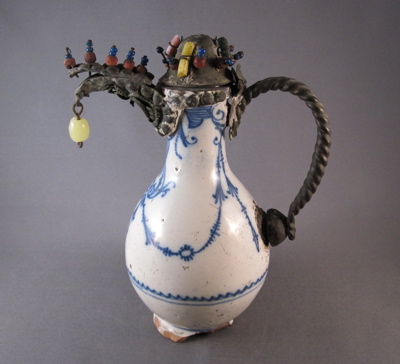 French Delft ewer, c.1690 Elaborate metal mounts with dangling glass “jewels” replace the original ceramic spout, handle and cover.