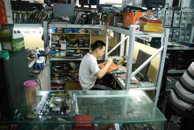 Repair technician at work. Beijing, China 2013