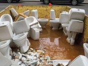 Old_toilet_bowls_removed_from_apartment_building